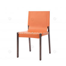 Orange saddle leather armless dining chairs